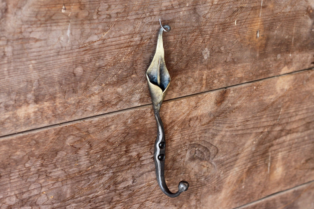 a blacksmith hand forged hook with a Calla Lily Flower detail by Wicks Forge