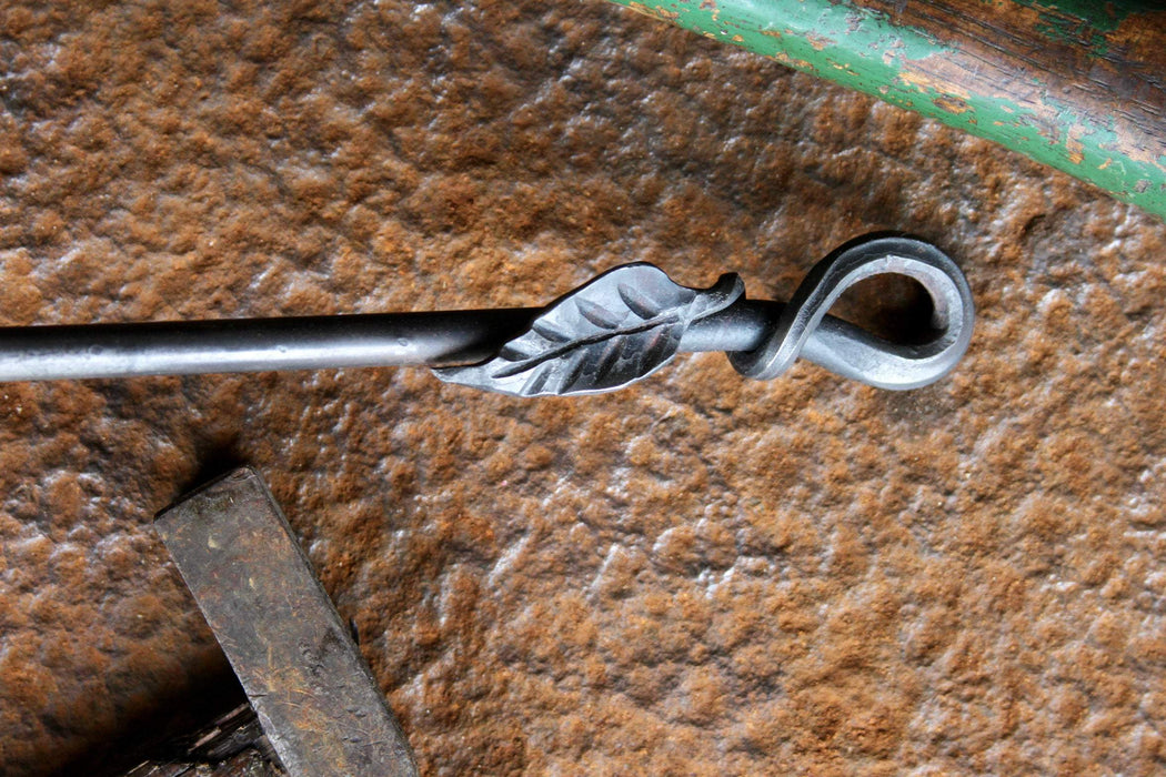 a blacksmith hand forged egg spoon with a leaf handle by Wicks Forge
