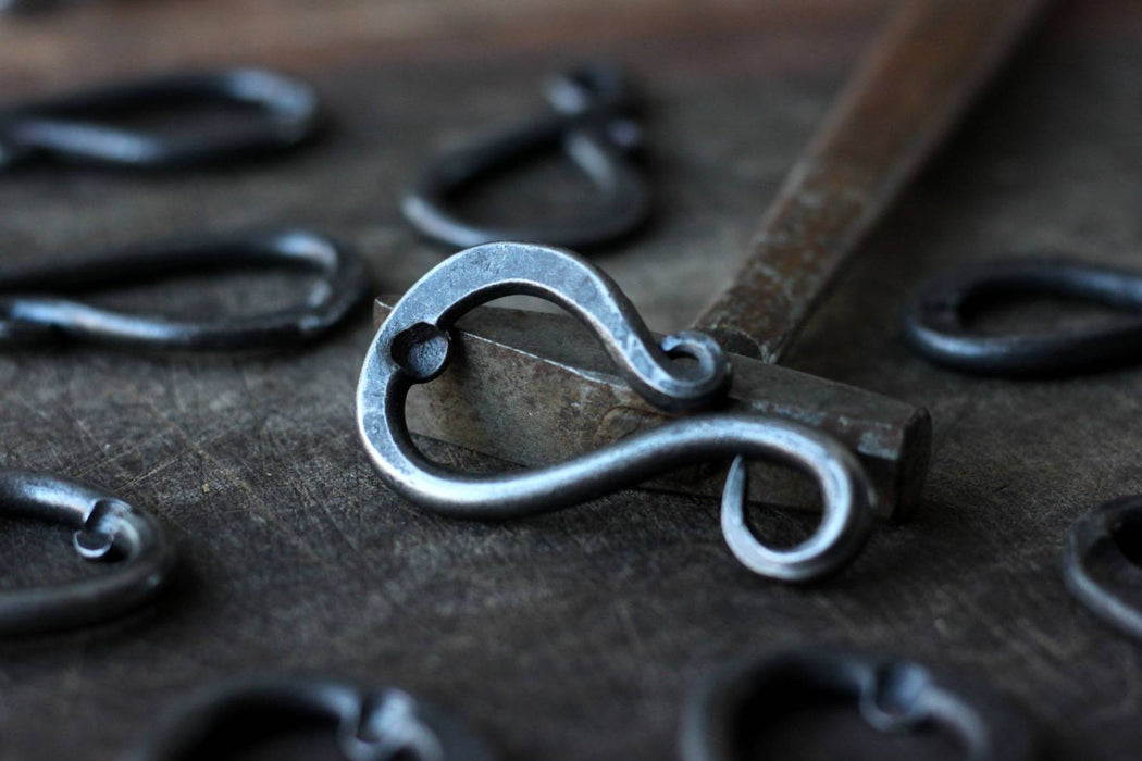 a blacksmith hand forged keychain bottle opener by Wicks Forge