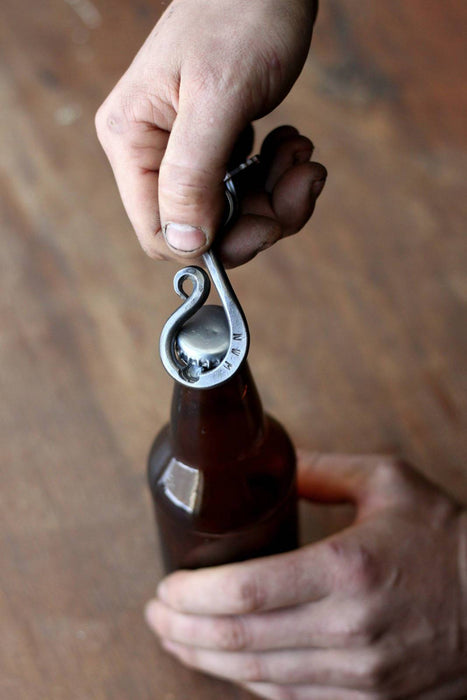 a blacksmith hand forged keychain bottle opener by Wicks Forge