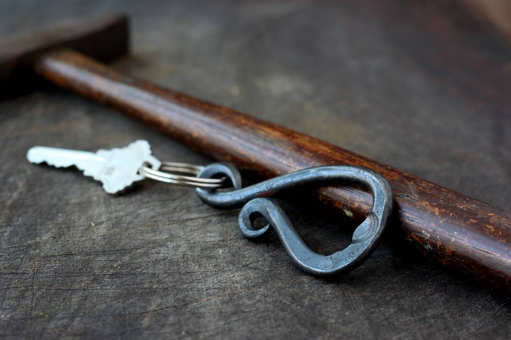 a blacksmith hand forged keychain bottle opener by Wicks Forge