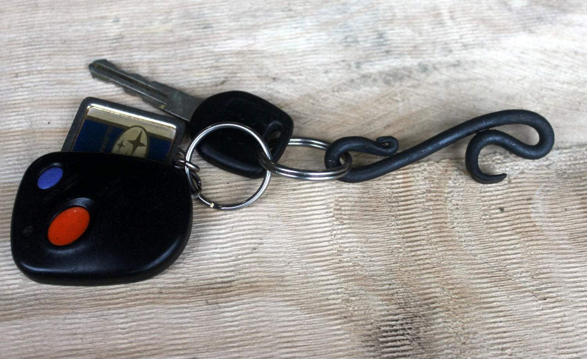 a blacksmith hand forged small keychain bottle opener by Wicks Forge