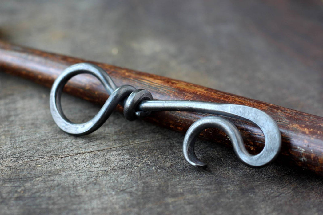 a blacksmith hand forged keychain bottle opener by Wicks Forge