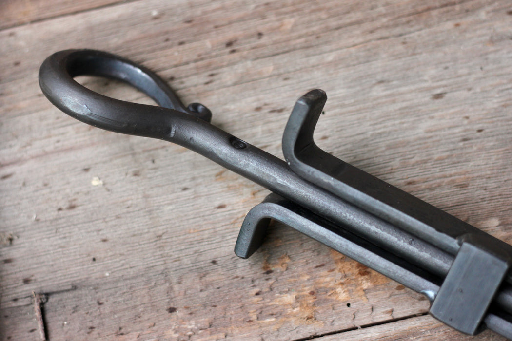 blacksmith hand forged fire poker and log grabber 