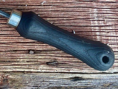 black handle of the iron garden weeder by wicks forge 