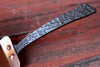 married handle cake server against a dark wood rustic table by wicks forge 