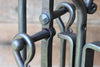 close up handles on a fire toolset showing rivets and handles 