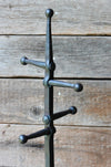 fireplace stand against a wooden wall by wicks forge 