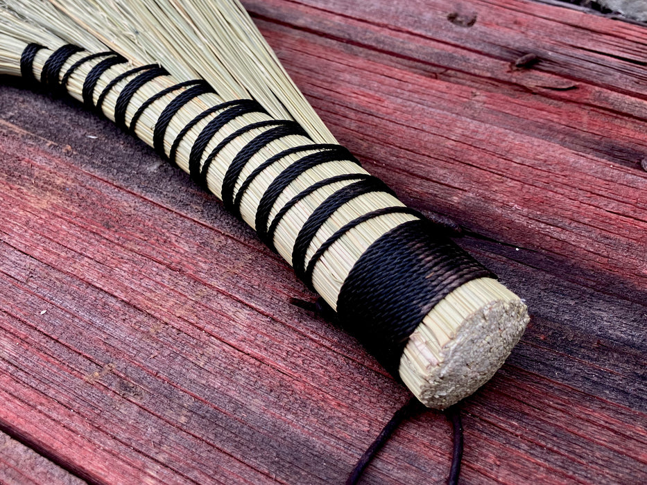 broom handle on a wooden table by wicks forge 