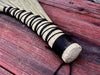 handle with woven twin on a wooden surface 