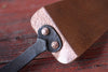 cake slicer showing rivets on a wooden background by wicks forge 