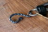 a blacksmith hand forged belt-loop keychain with a twist design by Wicks Forge