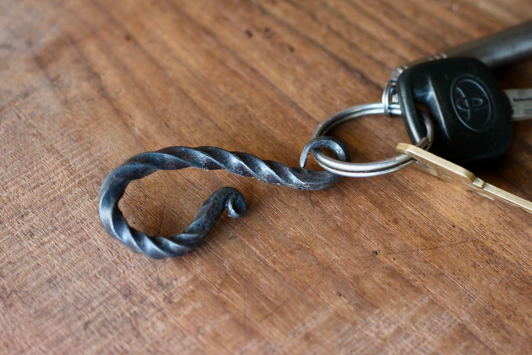 a blacksmith hand forged belt-loop keychain with a twist design by Wicks Forge