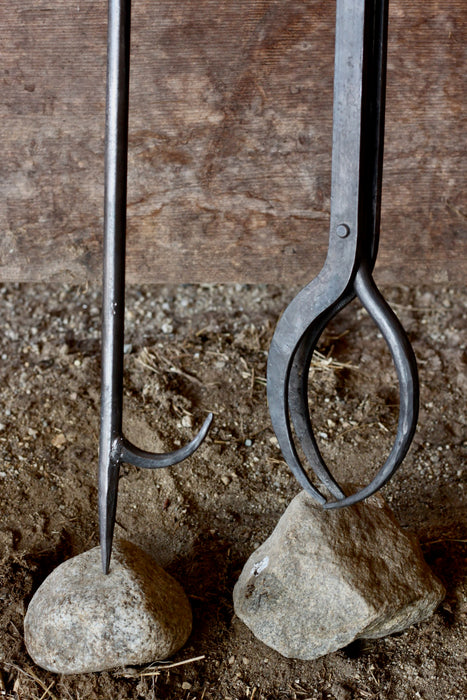 a blacksmith hand forged 34 inch fire poker and fireplace tongs by Wicks Forge