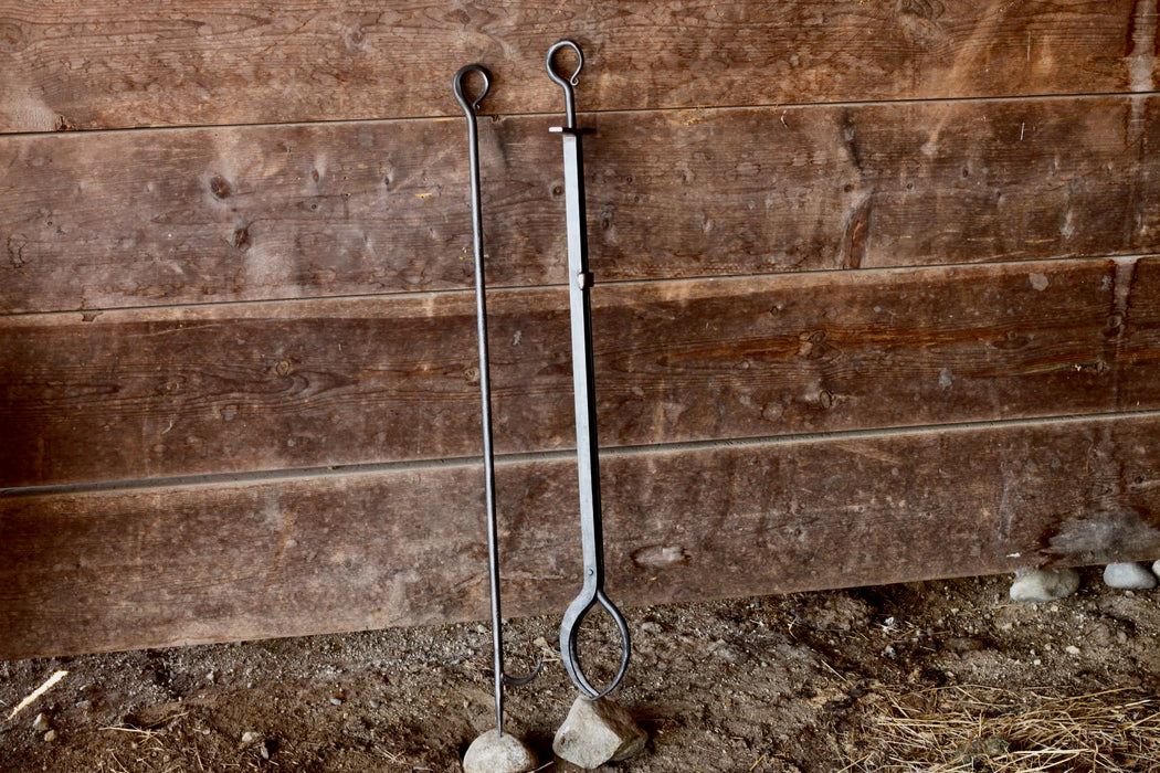 a blacksmith hand forged 34 inch fire poker and fireplace tongs by Wicks Forge