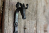 A blacksmith hand forged Ram style animal head hook by Wicks Forge