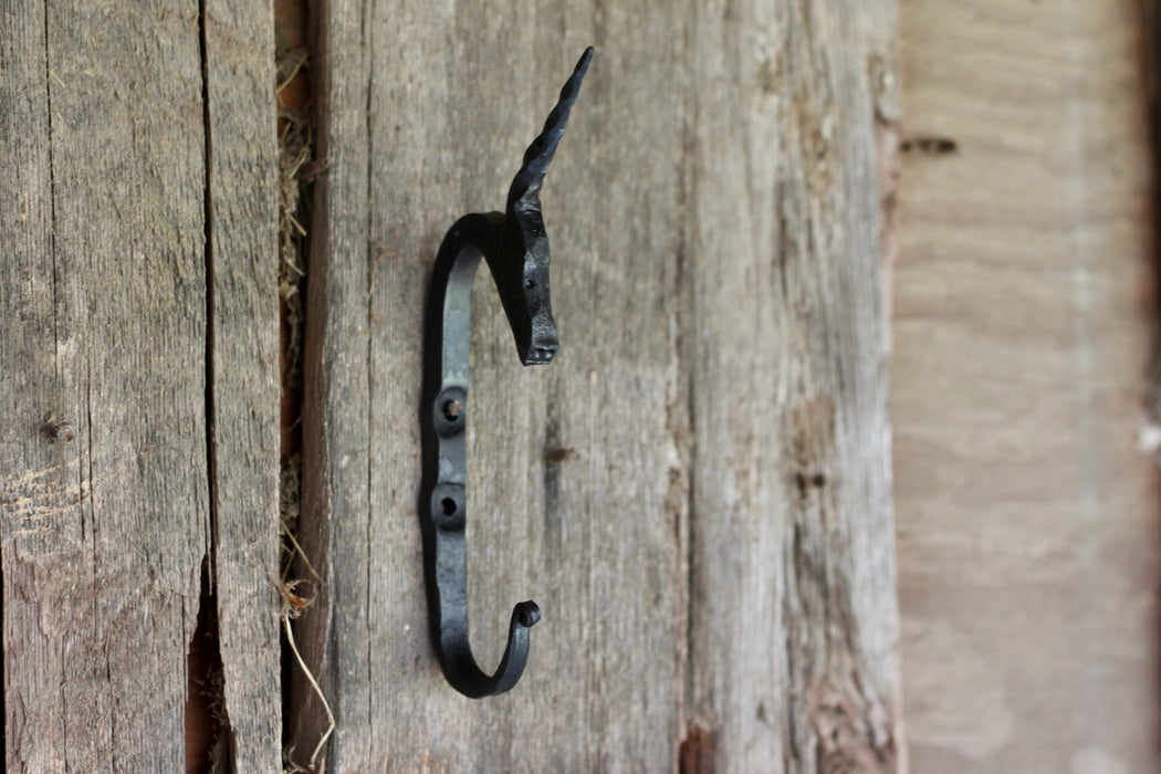 A blacksmith hand forged Unicorn style animal head hook by Wicks Forge