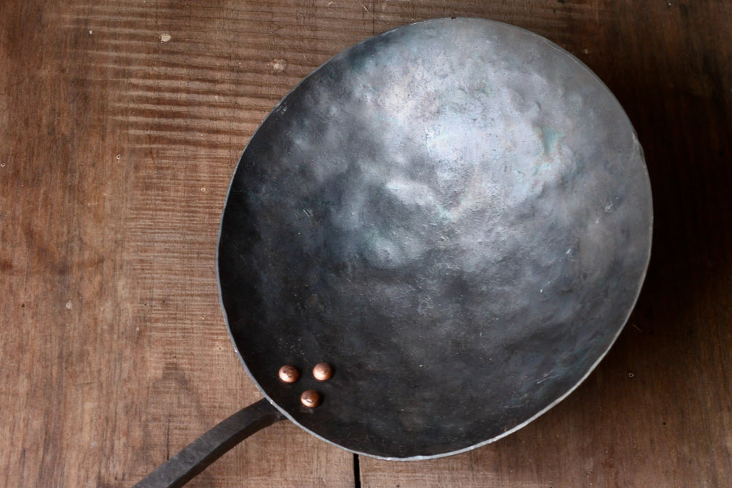 a blacksmith hand forged camping cooking pan by Wicks Forge