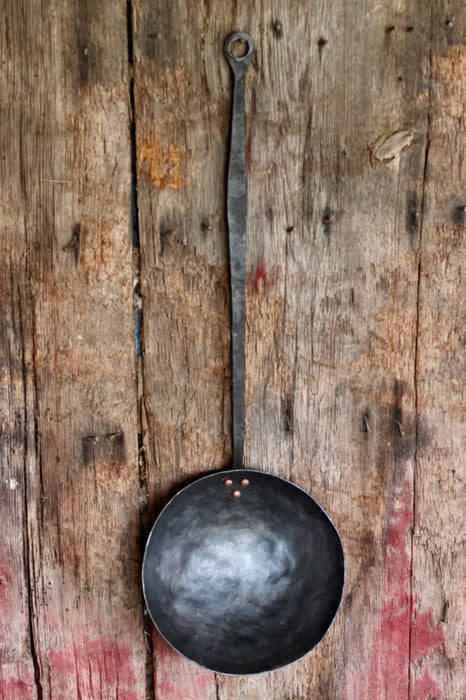 a blacksmith hand forged camping cooking pan by Wicks Forge