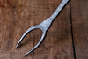 A blacksmith hand forged BBQ Fork with a circle handle by Wicks Forge