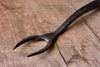 A blacksmith hand forged BBQ Fork with a circle handle by Wicks Forge