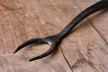 A blacksmith hand forged BBQ Fork with a circle handle by Wicks Forge