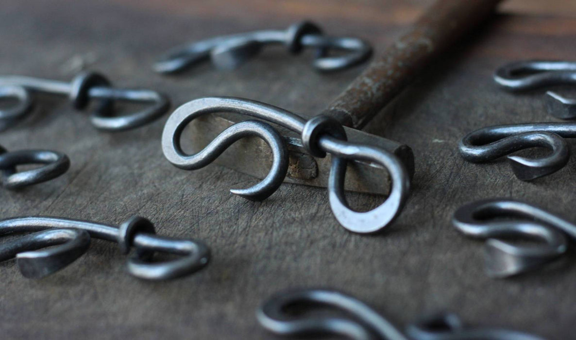 a blacksmith hand forged bottle opener by Wicks Forge