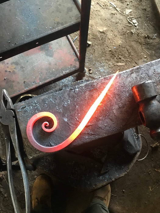 a bookend scroll in the process of being hand forged by Wicks Forge