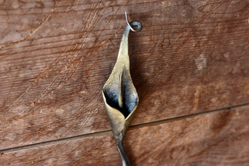 a blacksmith hand forged hook with a Calla Lily Flower detail by Wicks Forge