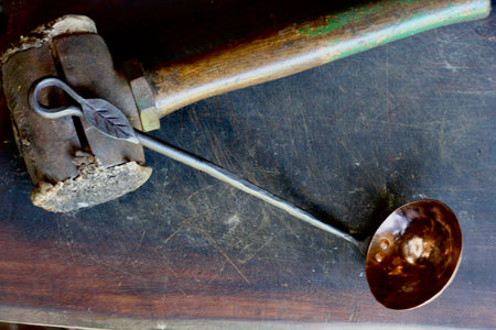 a blacksmith hand forged copper and steel ladle with a lead handle by Wicks Forge