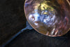 close up of the copper and steel ladle dish by Wicks Forge