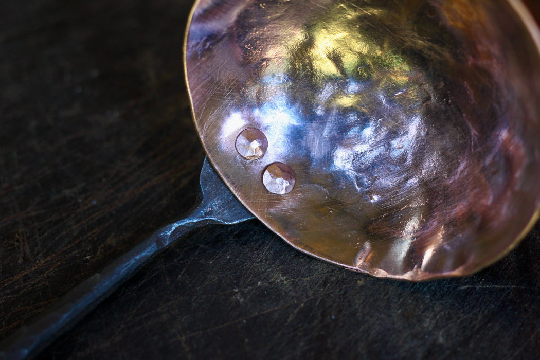 close up of the copper and steel ladle dish by Wicks Forge