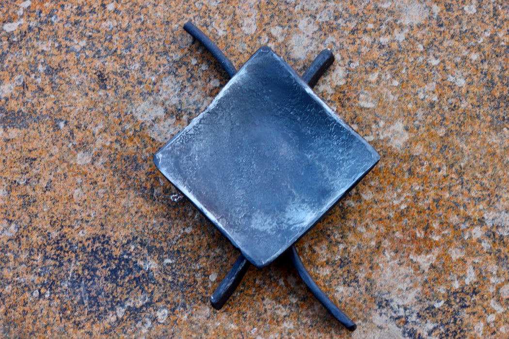 a blacksmith hand forged decorative candle stand by Wicks Forge