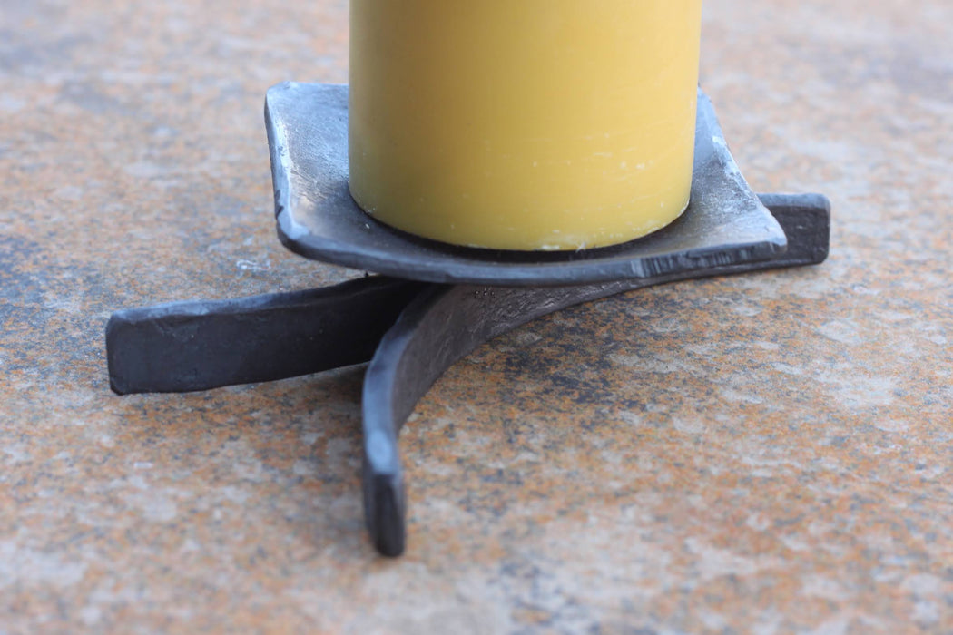 a blacksmith hand forged decorative candle stand by Wicks Forge