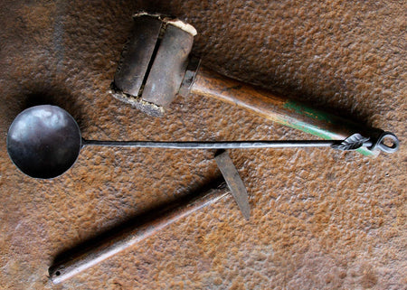 a blacksmith hand forged egg spoon with a leaf handle by Wicks Forge