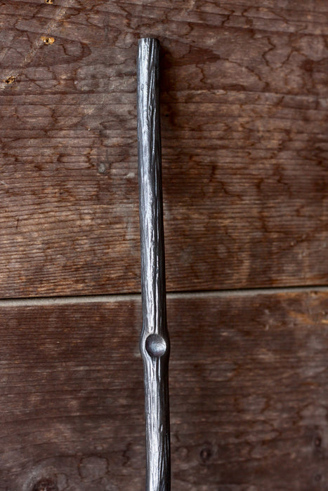 a blacksmith hand forged fire stick style fire poker by Wicks Forge