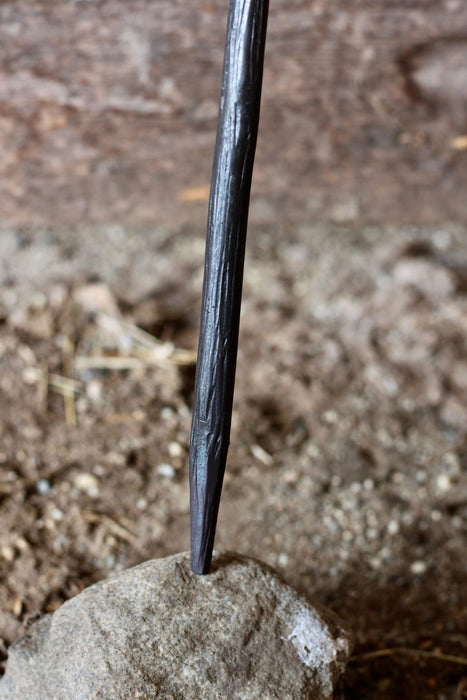 a blacksmith hand forged fire stick style fire poker by Wicks Forge