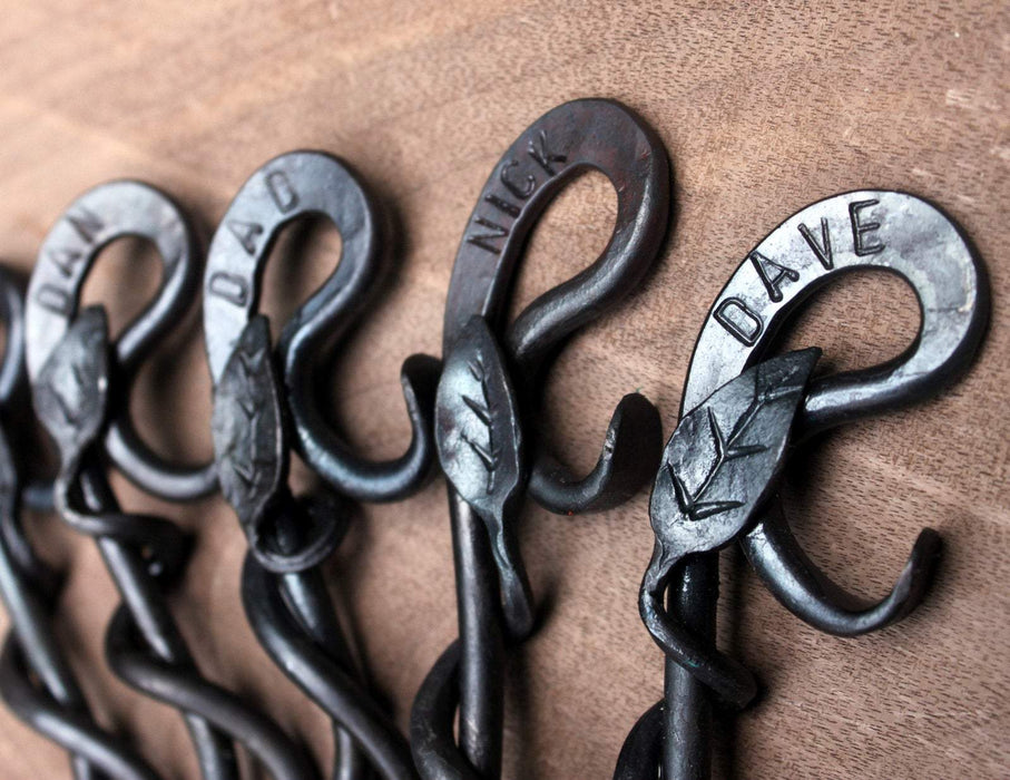a blacksmith hand forged personalized bottle opener with a leaf design by Wicks Forge