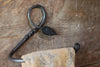  a blacksmith hand forged towel rack with a leaf design by Wicks Forge