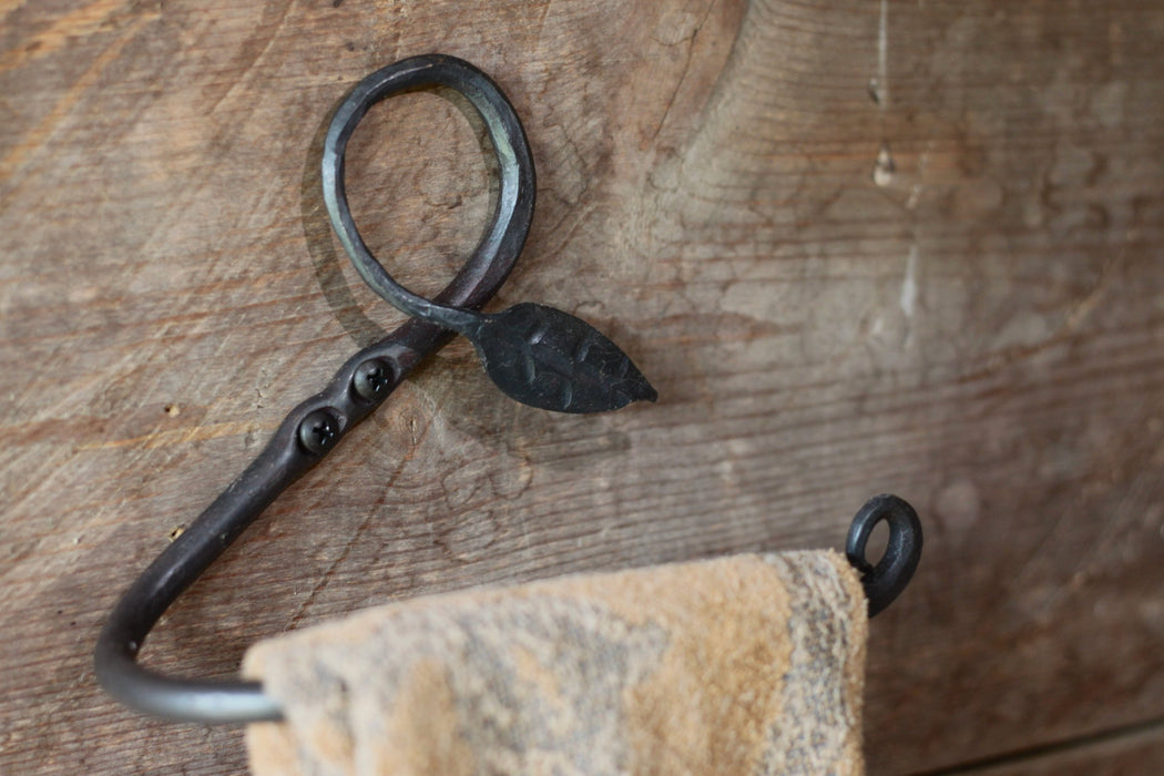  a blacksmith hand forged towel rack with a leaf design by Wicks Forge