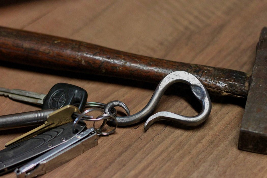 a blacksmith hand forged personalized belt loop keychain and bottle opener by Wicks Forge