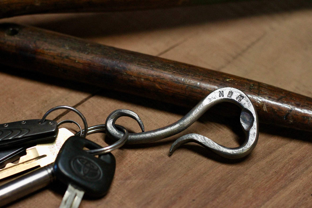 a blacksmith hand forged personalized belt loop keychain and bottle opener by Wicks Forge