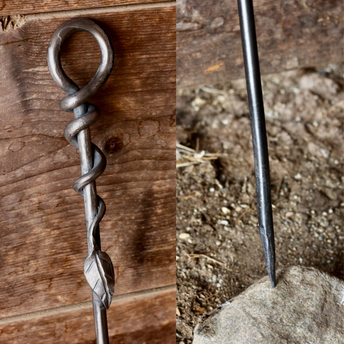 a blacksmith hand forged fire poker with a leaf wrap design by Wicks Forge