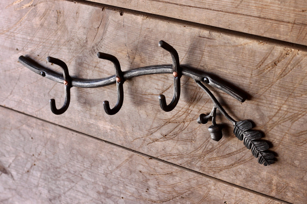 a blacksmith hand forged oak tree coat rack by Wicks Forge