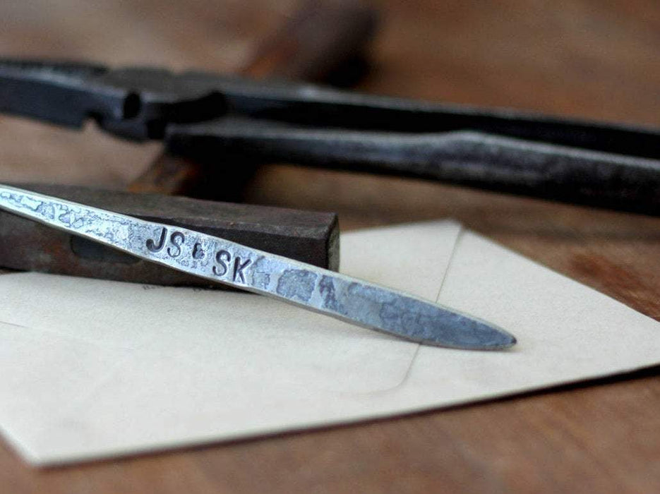 a blacksmith hand forged personalized letter opener with a fiddlehead spiral handle by Wicks Forge
