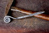a blacksmith hand forged letter opener with a fiddlehead spiral handle by Wicks Forge