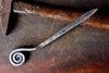 a blacksmith hand forged letter opener with a fiddlehead spiral handle by Wicks Forge