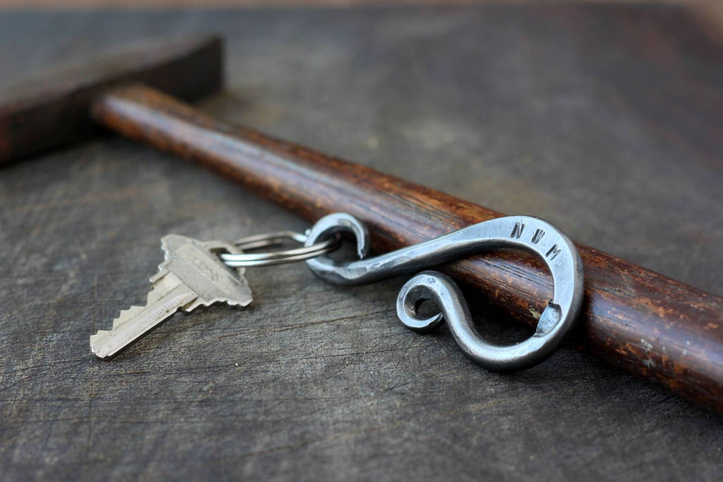 a blacksmith hand forged personalized keychain bottle opener by Wicks Forge
