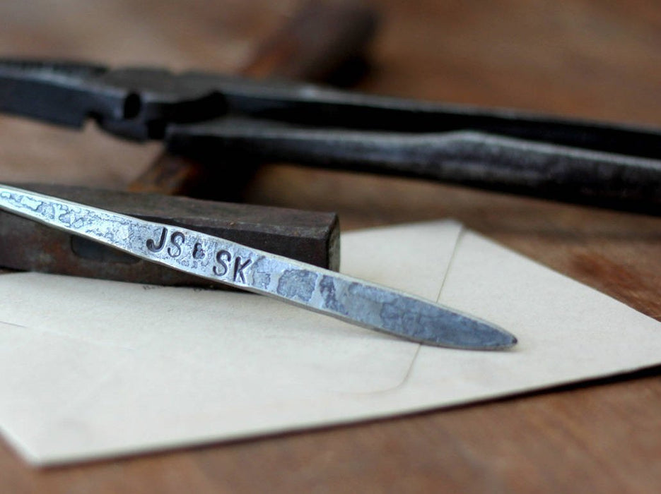 a blacksmith hand forged letter opener with a reverse curl handle by Wicks Forge