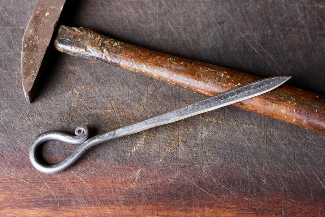 a blacksmith hand forged letter opener with a reverse curl handle by Wicks Forge